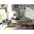 Fauteuil rembourré en cuir et pieds en acier noir