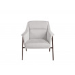 Fauteuil tapissé de tissu et pieds en acier brun.